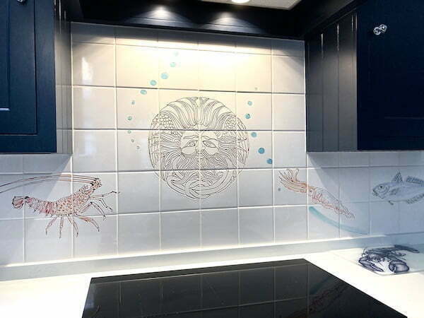 Roman fish and Bath Sulis head kitchen tiles